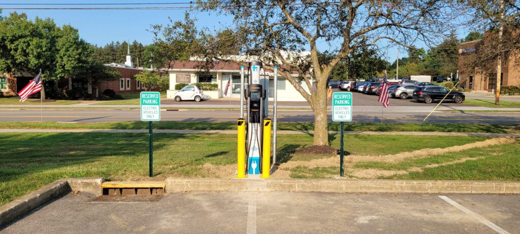 SkyCharge Energy electric vehicle charging station in Plain City, Ohio, with reserved parking signs.